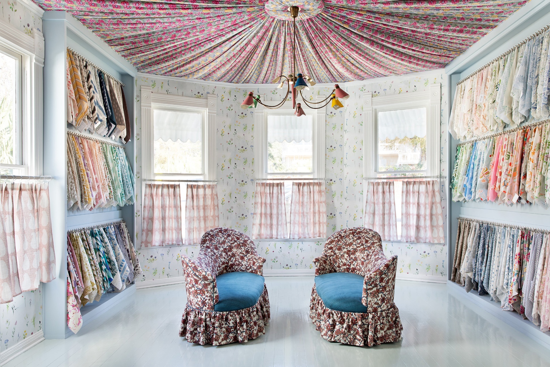 SUPPLY Showroom main library with fabric swatches lining the walls