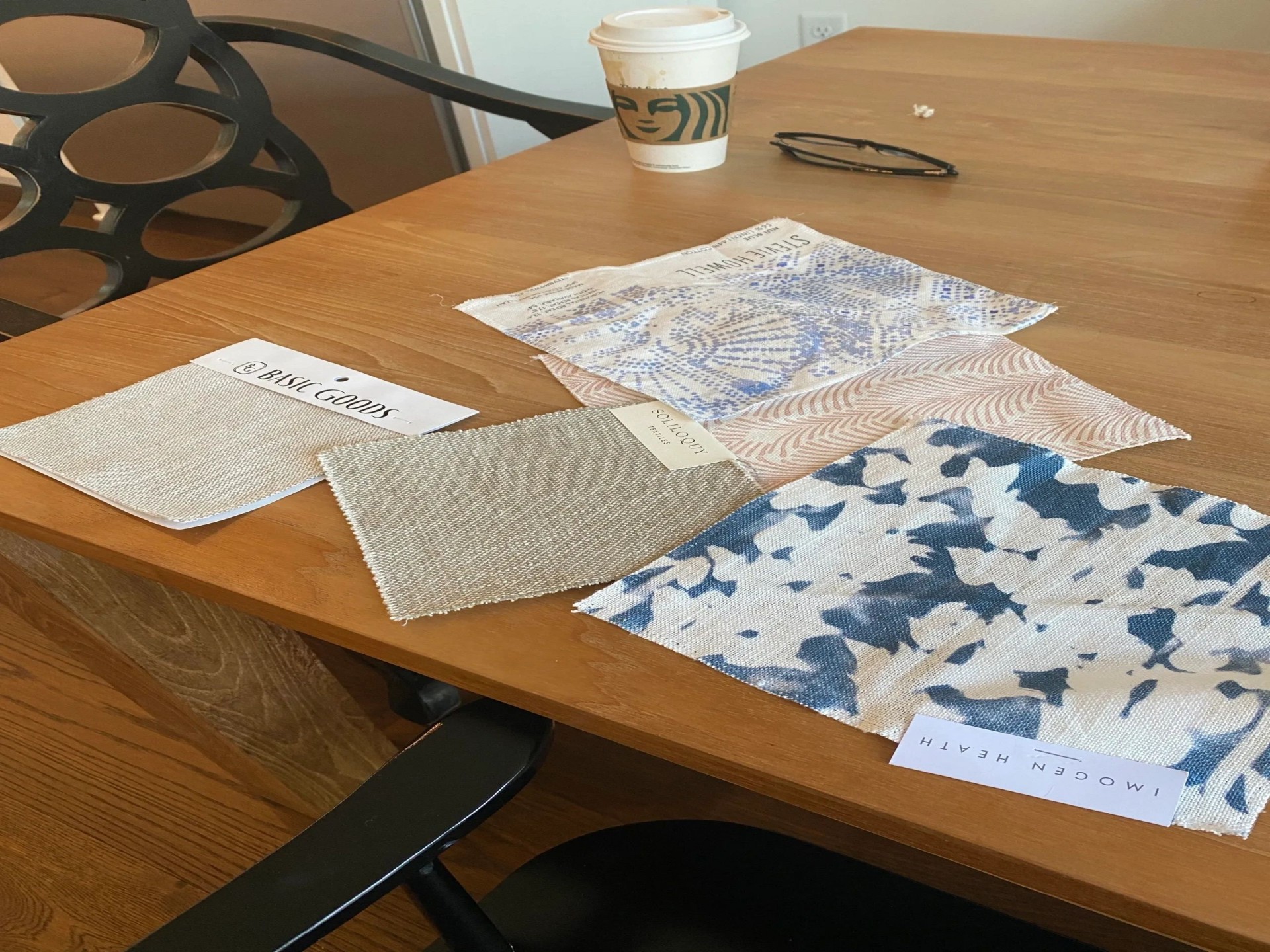 Curated fabric swatches on a designer's table
