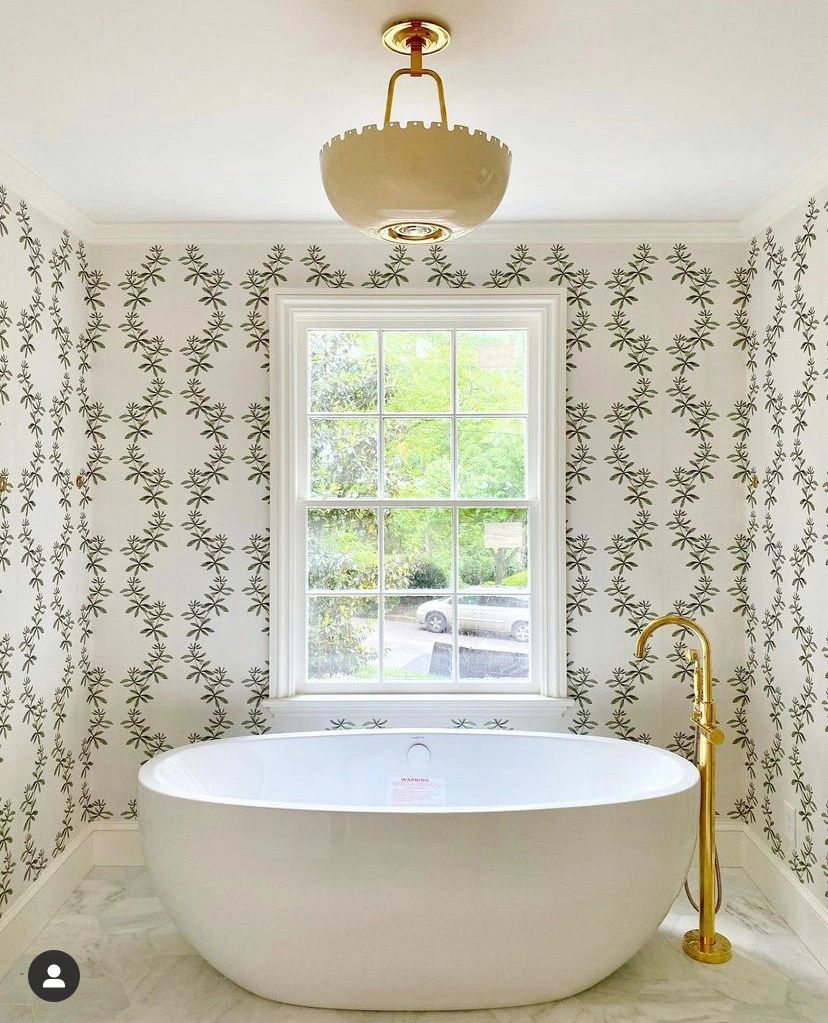 Bathroom with botanical wallpaper and freestanding tub